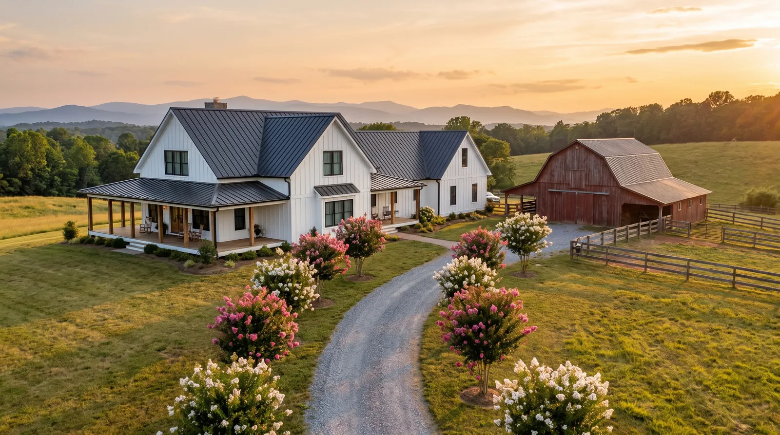 White modern farmhouse outside Greer with a charcoal standing-seam metal roof and matching barn