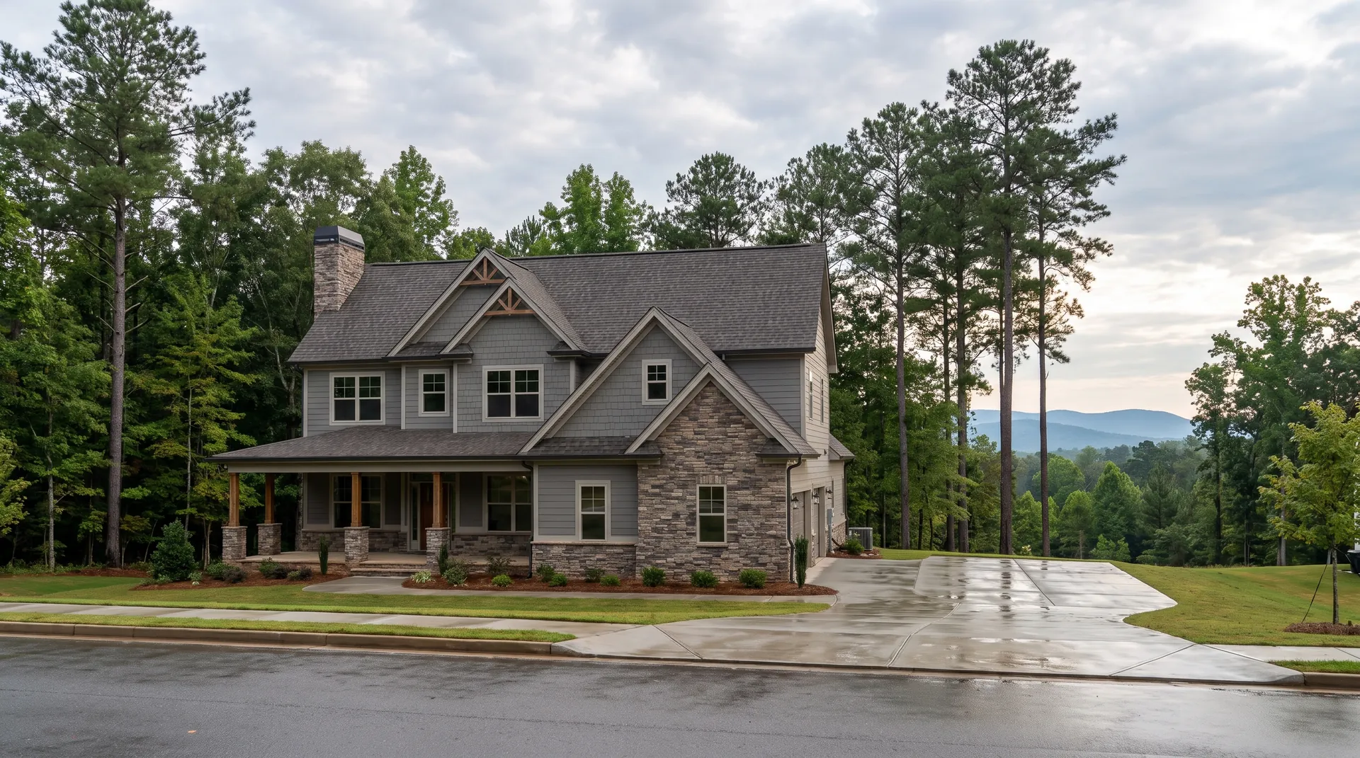 Craftsman home in a Greer, SC subdivision with a new weathered-wood architectural shingle roof after morning rain